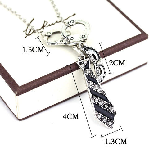 Handcuff Charm Necklace for Women – Silver Tone Pendant Necklace with Tie & Mask Charms (18” Chain)