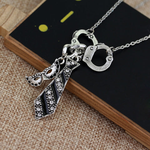Handcuff Charm Necklace for Women – Silver Tone Pendant Necklace with Tie & Mask Charms (18” Chain)